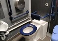 Accessible toilet with tied up red cord