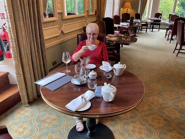 Image of a person sitting at a table