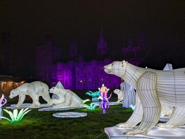 Image of Cardiff Castle at night with festive polar bear decorations