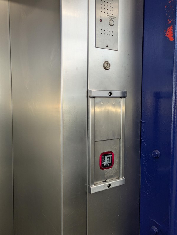 Image of lift buttons. The lift buttons have Braille Markings