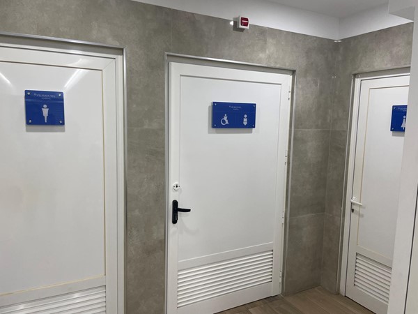 image of doors too toilets, including the accessible toilet