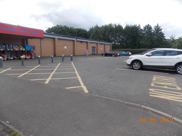 Car park the Blue Badge spaces are along the wall of the store