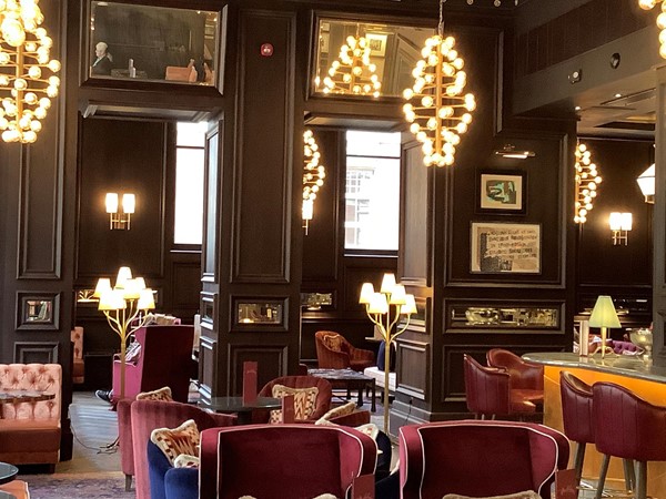 Chairs and tables in an opulent bar