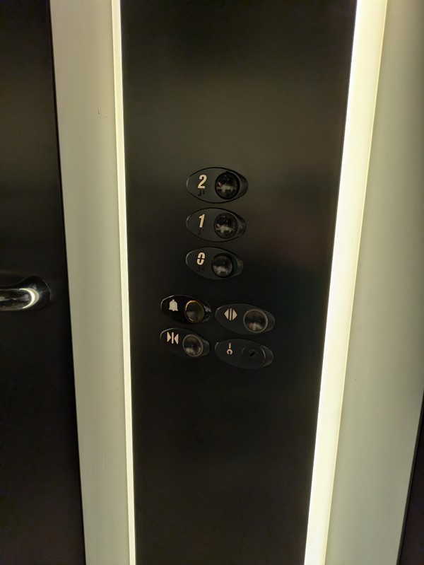 Image of lift buttons. The lift buttons have Braille Markings