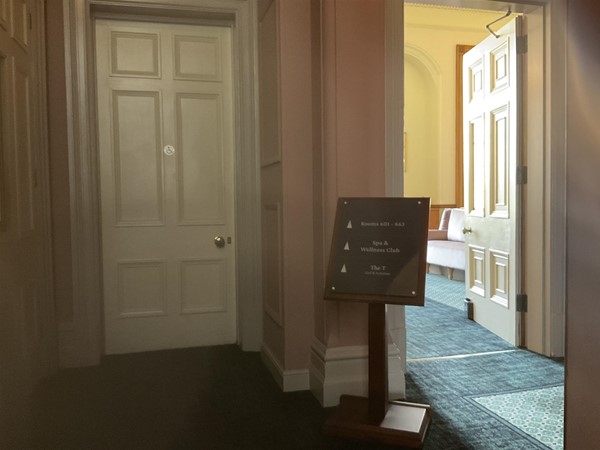 Image of a door and a sign in a room