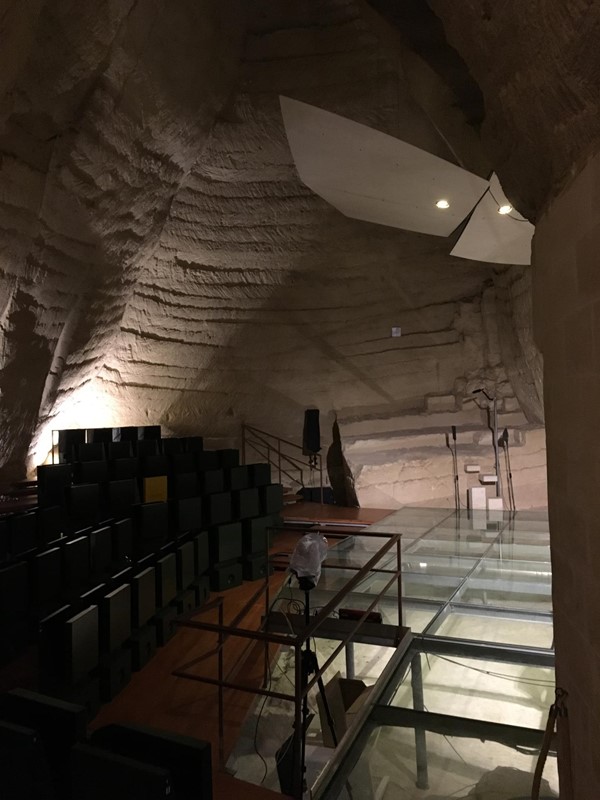 Cave with performance space and seating area