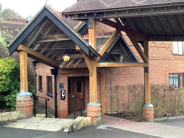 carer needs to be careful, and best if you swing past the slope bit before you turn and enter the door. You will still have to have someone open the door for you though before you enter a wide but attractive  hallway