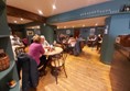 Image of a group of people sitting at tables