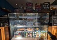 Image of cake cabinet with soft drinks