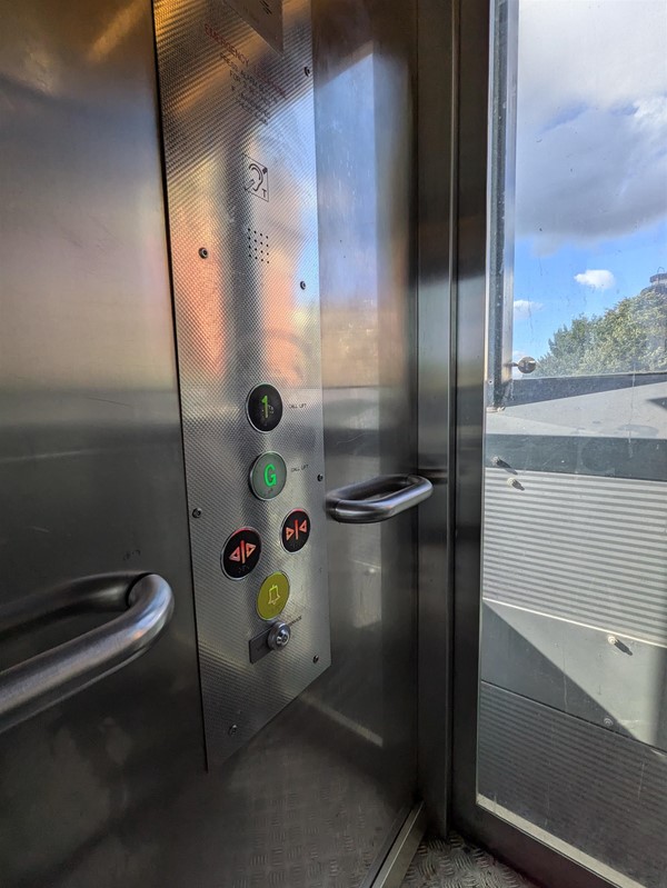 Image of the buttons on the inside of the lift, all have braille markings