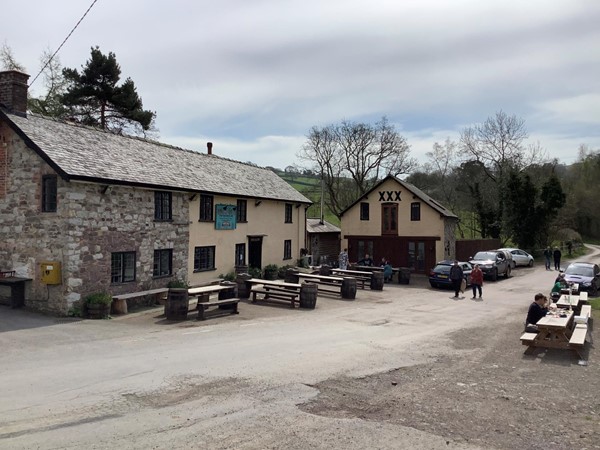 Picture of a pub with picnic tables