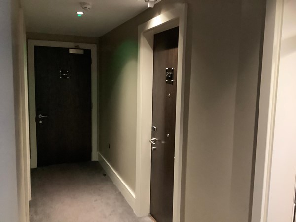 Corridor leading to hotel bedroom