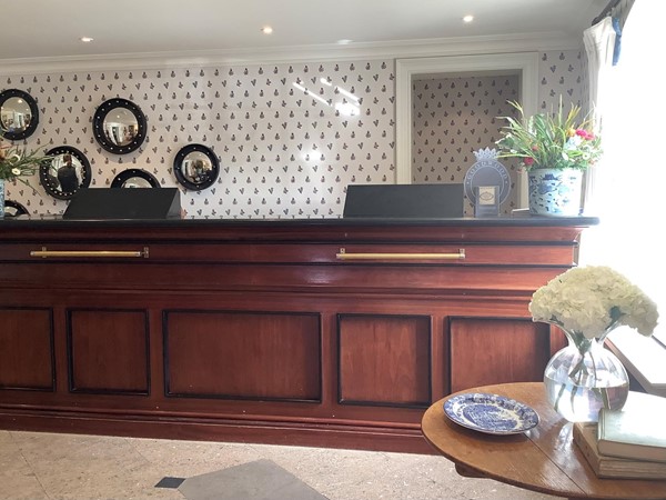 Image of a reception desk in a hotel