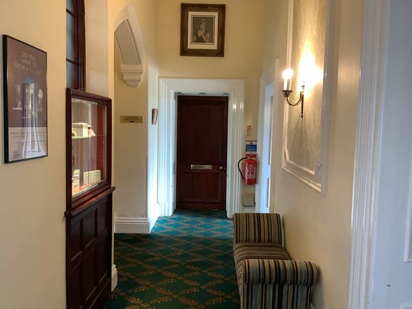 Picture of a corridor with a door at the end