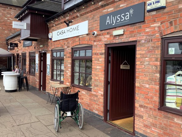 Picture of a wheelchair outside a shop