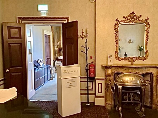 Image of a room with a mirror and a fireplace