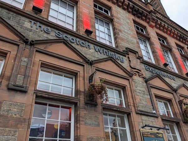 The outside of The Scotch Whisky Experience with many windows.