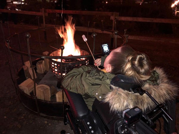 Image of Claire at the marshmallow roasting area.