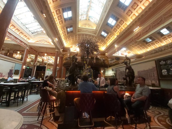 Image of a group of people sitting at tables in a restaurant