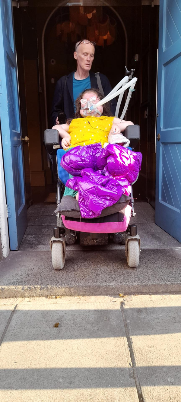 Powerchair user and p.a in the doorway