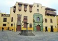 The outside of the museum, on the right where the man is sanding is the exit