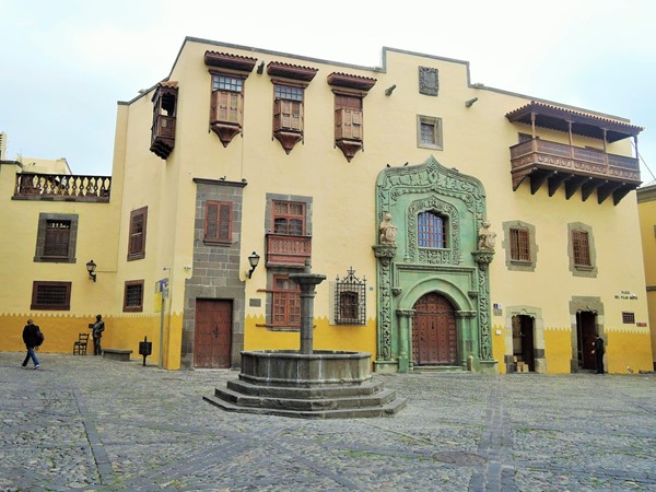 The outside of the museum, on the right where the man is sanding is the exit