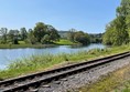 The path runs alongside the  Haverthwaite Steam Railway