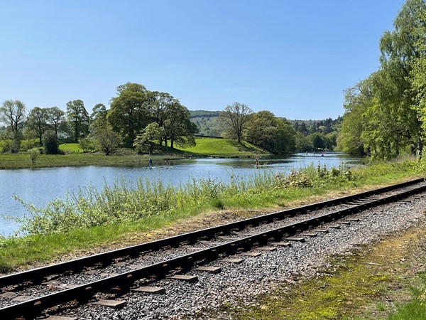 The path runs alongside the  Haverthwaite Steam Railway