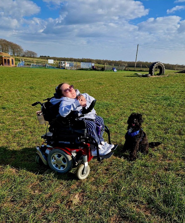 Image of Claire and Sheldon at the dog park.