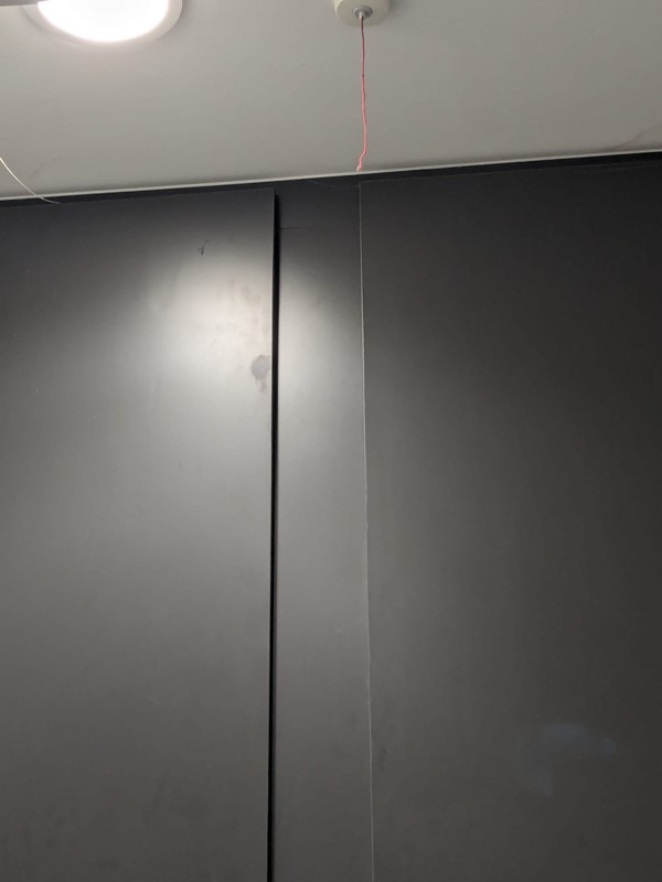 Picture of a red cord that has been cut and is out of reach