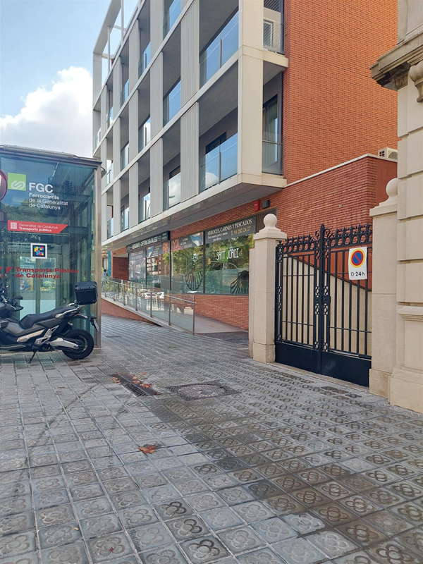 Image of a red brick building with a galss front