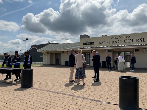 Image of a group of people outside of a building