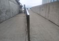 Image of a concrete walkway with a railing