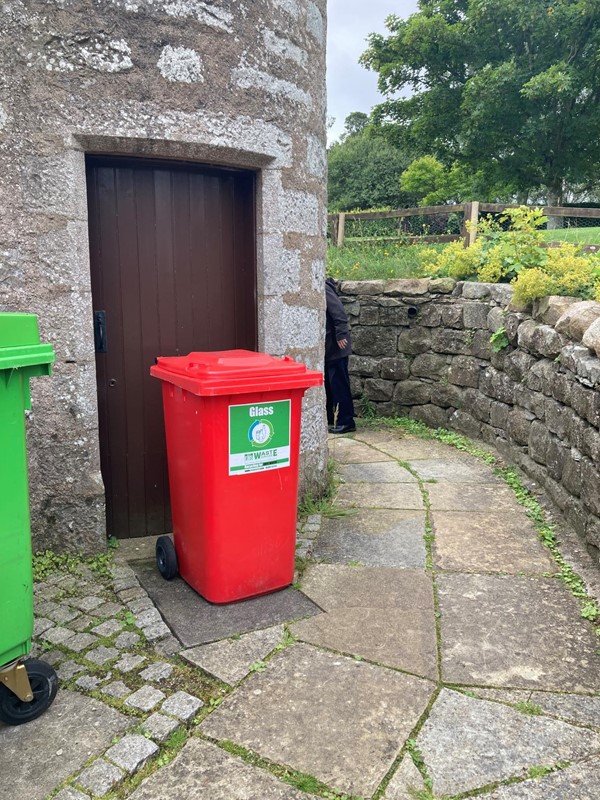 Wheelie bins on path to toilet