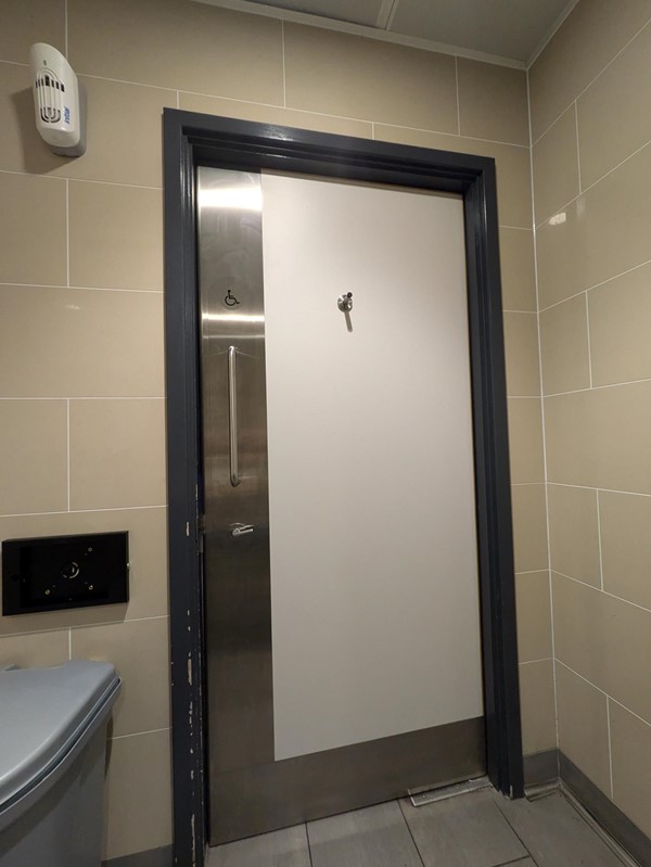 Image of the grab rail on the door to the accessible toilets