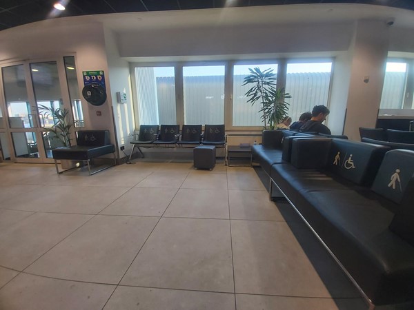 Image of a group of people sitting in a waiting room