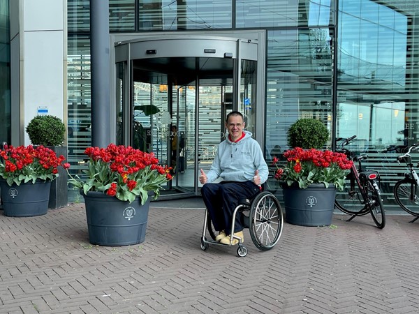 Paul sitting outside of the main entrance to the hotel