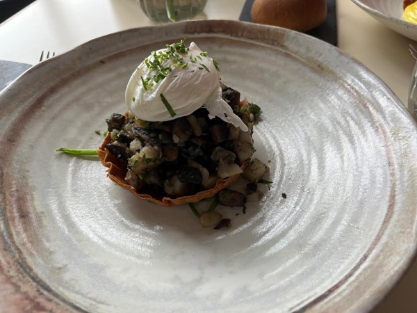 Image of my main, Portobello mushroom hash pastry with soft poached egg and wild leek.