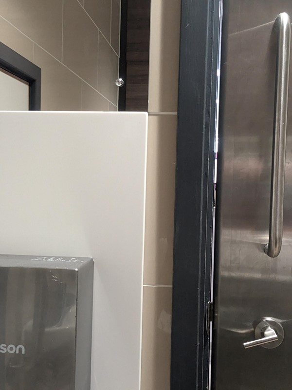 Image of the grab rail on the door to the accessible toilets