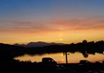 The view at sunset from the deck of the resturant at the Wide Mouthed Frog Hotel, north of Oban.