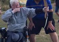 My husband having a go at archery from his wheelchair. This pic is from a couple of years ago as his arms are now too weak. Photo is to show what is still available.