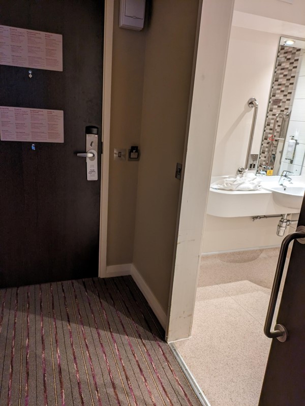 Image of the entrance to the bathroom next to the door