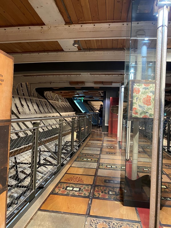 a view taken on the entry level deck looking along towards the back of the ship- showing the pinch point. The gangway widens around a lift in the middle, and you go around either side, but it is a little narrow.