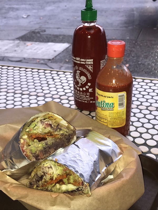 My old standby - Vegetarian with extra guacamole and easy sour cream. Amazing. Get them  to cut it in half and you can split it with a friend.  It’s very big.