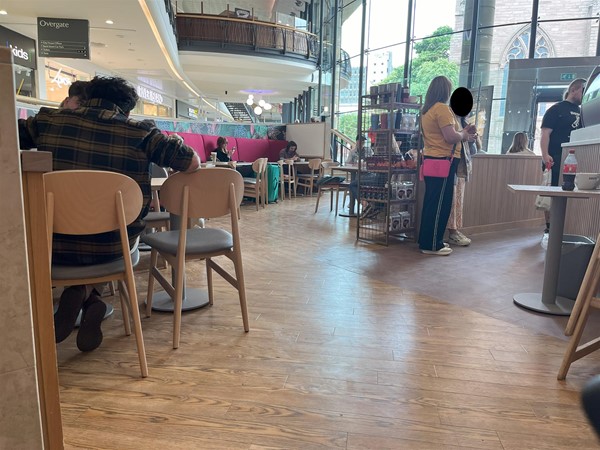 Image of part of the seating area in Costa Coffee.