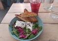 Image of a bowl of salad and toast on a table