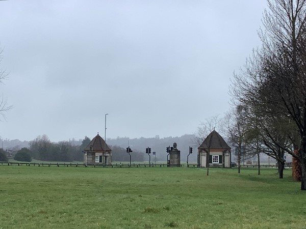 Two small buildings on each side of the main A308, known as “Piers”