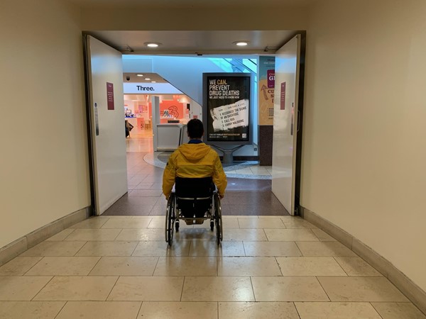 Paul wheels from the side entrance back and in toward the shopping centre