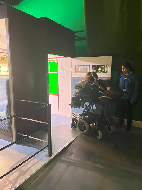 Image of me going into the train area in my wheelchair.