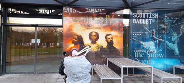 Reviewer in front of poster